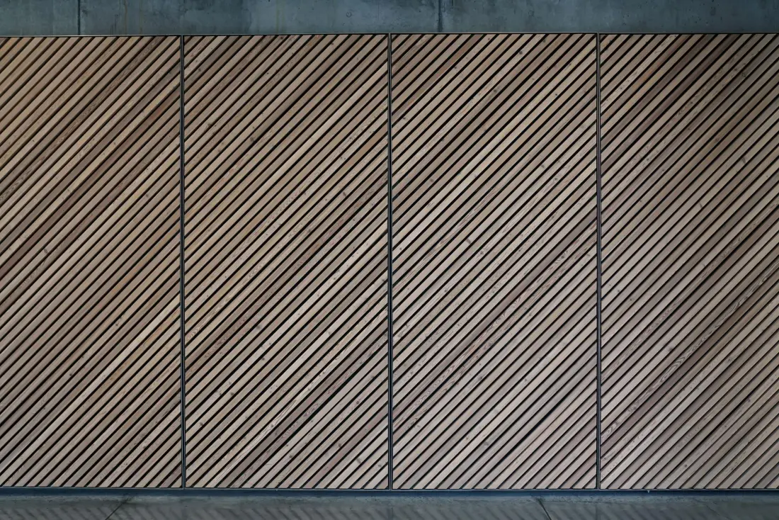 Close-up of a slatted timber feature wall with diagonal battens